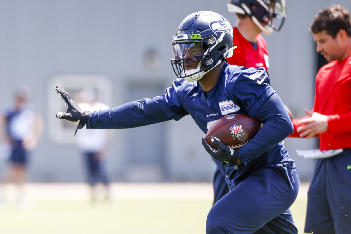 Seattle Seahawks running back Ken Walker III (9) participates in a drill during an OTA workout at the Virginia Mason Athletic Center.